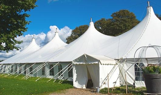 portable toilet units set up at a music festival, offering attendees a convenient and sanitary solution for bathroom needs in Exeter